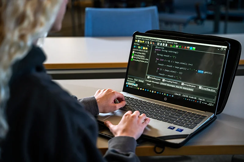 a student typing code on a computer Information Security Program Ranked #4 Best Bachelor's Programs in Pennsylvania